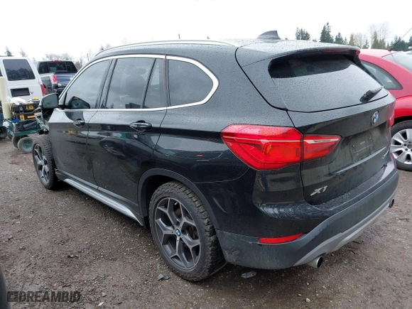 2018 BMW X1 xDrive28i with VIN WBXHT3C39J3H30531, listed as a IAAI auction lot 41890734 with 59,147 mi miles. Bid and sale history available at carsss.com. Image 3.