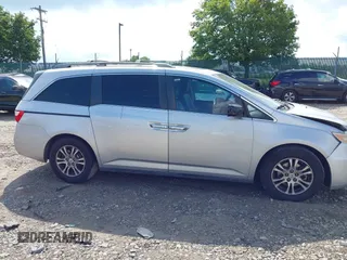 2012 Honda Odyssey EX-L with VIN 5FNRL5H61CB081634, listed as a IAAI auction lot 42760909 with 197,949 mi miles and . Bid and sale history available at DreamBid. Image 14.