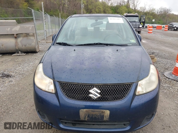 2011 Suzuki SX4 LE with VIN JS2YC5A23B6304713, listed as a IAAI auction lot 41997287 with 114,024 mi miles. Bid and sale history available at carsss.com. Image 12.