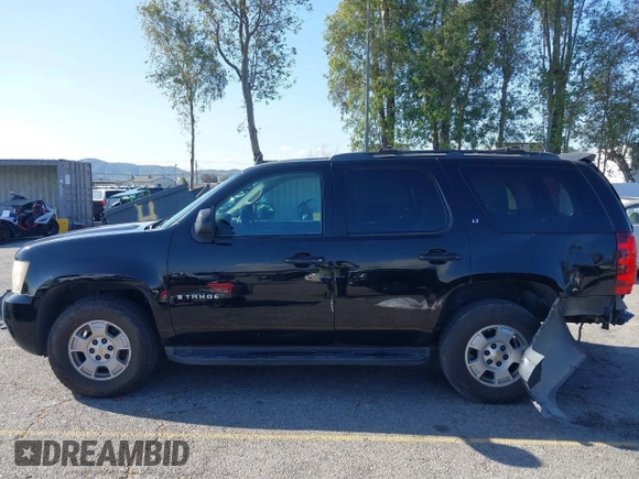2009 Chevrolet Tahoe 2LT z VIN 1GNFC23059R186790, wystawiony jako IAAI lot #41929109 z przebiegiem 263 596 mil mil oraz . Historia ofert i sprzedaży dostępna na DreamBid. Obrazek 14.