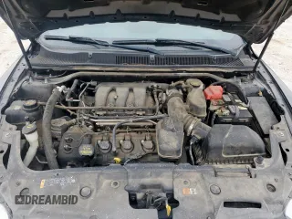 2014 Ford Taurus SEL z VIN 1FAHP2E84EG133955, wystawiony jako Copart lot #56630155 z przebiegiem 113 045 mil mil oraz Szkoda całkowita • Salvage title. Historia ofert i sprzedaży dostępna na DreamBid. Obrazek 11.