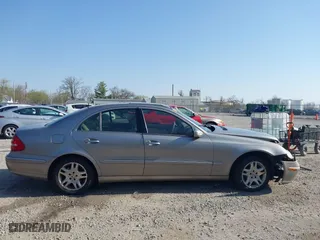 2003 Mercedes-Benz E-Class 3.2L with VIN WDBUF65J93X099223, listed as a IAAI auction lot 42033473 with 230,758 mi miles. Bid and sale history available at carsss.com. Image 13.