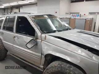 1998 Jeep Grand Cherokee Laredo with VIN 1J4GZ48Y9WC206957, listed as a IAAI auction lot 41848433 with 122,104 mi miles. Bid and sale history available at carsss.com. Image 6.