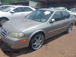 2002 Nissan Maxima GXE z VIN JN1DA31D02T202083, wystawiony jako IAAI lot #42496695 z przebiegiem 156 491 mil mil oraz . Historia ofert i sprzedaży dostępna na DreamBid. Obrazek 2.
