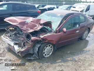 2001 Nissan Maxima SE with VIN JN1CA31D31T813090, listed as a IAAI auction lot 42389423 with 144,015 mi miles and . Bid and sale history available at DreamBid. Image 2.