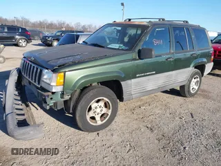1997 Jeep Grand Cherokee Laredo with VIN 1J4GZ58SXVC687950, listed as a IAAI auction lot 40978411 with 176,514 mi miles. Bid and sale history available at carsss.com. Image 2.