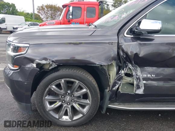 2015 Chevrolet Suburban LTZ with VIN 1GNSKKKC4FR589913, listed as a IAAI auction lot 42017190 with 216,145 mi miles. Bid and sale history available at carsss.com. Image 6.