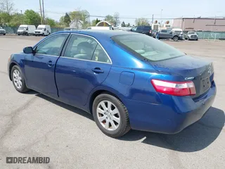 2007 Toyota Camry CE with VIN JTNBE46K373056707, listed as a IAAI auction lot 42128026 with 242,887 mi miles. Bid and sale history available at carsss.com. Image 3.