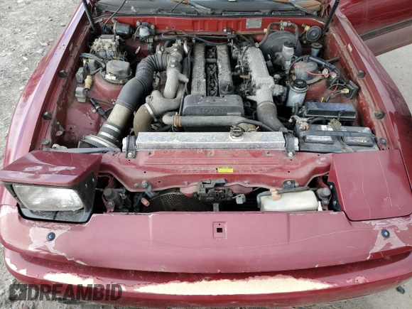 1987 Toyota Supra z VIN JT2MA71J4H0068594, wystawiony jako Copart lot #81918653 z przebiegiem 91 630 mil mil oraz Szkoda całkowita • Salvage title. Historia ofert i sprzedaży dostępna na DreamBid. Obrazek 11.