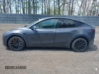 2020 Tesla Model Y Long Range with VIN 5YJYGDEE2LF029385, listed as a IAAI auction lot 42164786 with 58,685 mi miles and . Bid and sale history available at DreamBid. Image 14.
