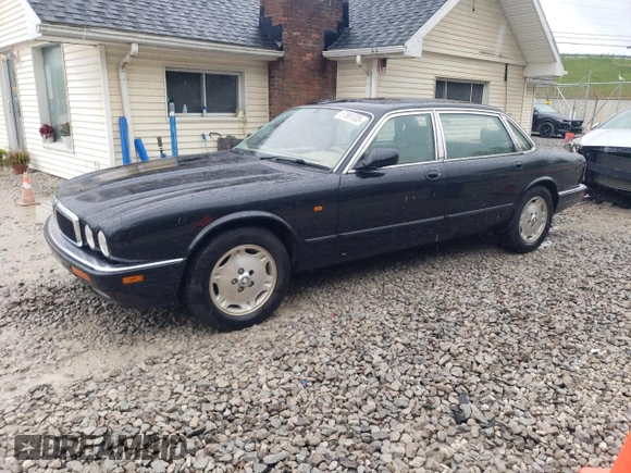 1997 Jaguar XJ with VIN SAJHX6248VC806189, listed as a Copart auction lot 57891035 with 51,654 mi miles and Salvage title. Bid and sale history available at DreamBid. Image 1.