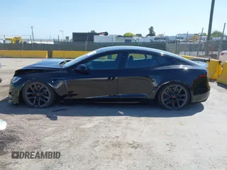 2022 Tesla Model S Plaid with VIN 5YJSA1E61NF483354, listed as a IAAI auction lot 41973636 with 32,541 mi miles and . Bid and sale history available at DreamBid. Image 14.