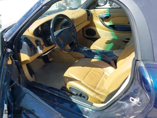 1999 Porsche Boxster with VIN WP0CA2983XU624800, listed as a IAAI auction lot 41897145 with 86,407 mi miles. Bid and sale history available at carsss.com. Image 8.