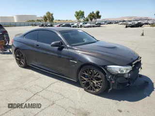 2015 BMW M4 with VIN WBS3R9C50FK333819, listed as a Copart auction lot 61105565 with 168,932 mi miles and Salvage title. Bid and sale history available at DreamBid. Image 4.