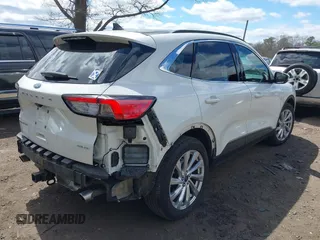2021 Ford Escape Titanium with VIN 1FMCU9J94MUA27571, listed as a IAAI auction lot 42008938 with 32,592 mi miles and . Bid and sale history available at carsss.com. Image 4.