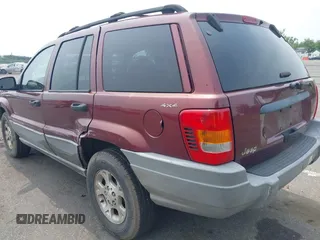 2000 Jeep Grand Cherokee Laredo z VIN 1J4GW48S2YC288439, wystawiony jako IAAI lot #42492798 z przebiegiem 272 527 mil mil oraz . Historia ofert i sprzedaży dostępna na DreamBid. Obrazek 3.