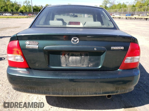 1999 Mazda Protege DX with VIN JM1BJ2223X0139775, listed as a Copart auction lot 54338455 with 63,198 mi miles and Salvage Title. Bid and sale history available at DreamBid. Image 6.