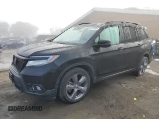 2021 Honda Passport Touring z VIN 5FNYF7H96MB011542, wystawiony jako Copart lot #85740944 z przebiegiem 80 648 mil mil oraz Szkoda całkowita • Salvage title. Historia ofert i sprzedaży dostępna na DreamBid. Obrazek 1.