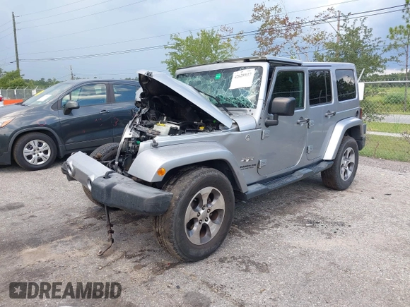 2016 Jeep Wrangler Unlimited Sahara with VIN 1C4BJWEG3GL240859, listed as a IAAI auction lot 42628937 with 103,378 mi miles and . Bid and sale history available at DreamBid. Image 17.