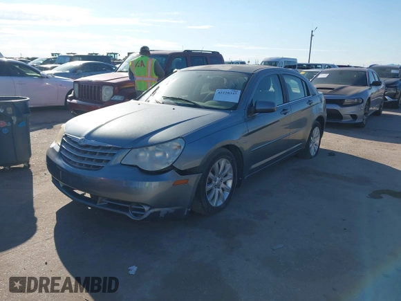 2010 Chrysler Sebring Limited with VIN 1C3CC5FD6AN190813, listed as a IAAI auction lot 42228345 with 113,512 mi miles and . Bid and sale history available at DreamBid. Image 2.