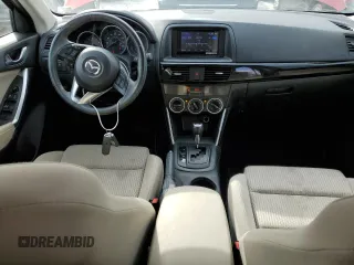 2014 Mazda CX-5 Touring with VIN JM3KE2CY6E0316041, listed as a Copart auction lot 52227835 with 69,921 mi miles and Salvage Title. Bid and sale history available at DreamBid. Image 8.