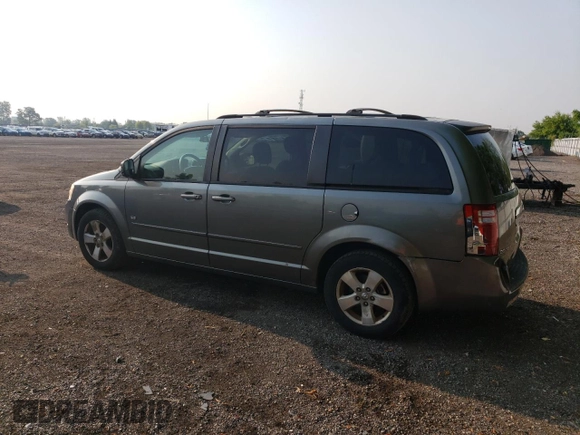 2009 Dodge Grand Caravan SE with VIN 2D8HN44E29R694728, listed as a Copart auction lot 60287565 with 233,018 mi miles and Clean title. Bid and sale history available at DreamBid. Image 2.
