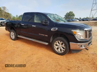 2016 Nissan Titan XD PRO-4X with VIN 1N6BA1F45GN506648, listed as a Copart auction lot 74381534 with 154,114 mi miles and Salvage Title. Bid and sale history available at carsss.com. Image 4.