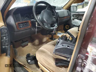 1996 Jeep Grand Cherokee Laredo with VIN 1J4GZ58Y1TC171915, listed as a Copart auction lot 50764034 with 0 mi miles and Salvage Title. Bid and sale history available at carsss.com. Image 8.