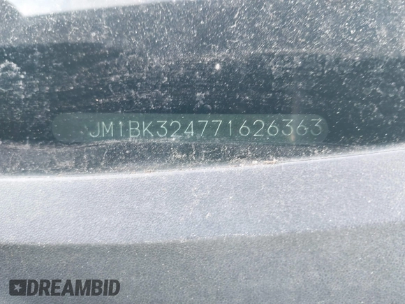 2007 Mazda 3 S Touring with VIN JM1BK324771626363, listed as a IAAI auction lot 41487684 with 220,889 mi miles and . Bid and sale history available at DreamBid. Image 9.