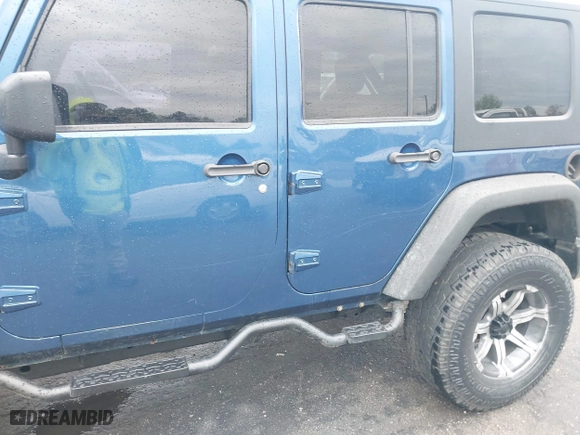 2010 Jeep Wrangler Unlimited Sport with VIN 1J4BA3H11AL144560, listed as a IAAI auction lot 42013032 with 226,233 mi miles. Bid and sale history available at carsss.com. Image 6.