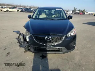 2015 Mazda CX-5 Sport z VIN JM3KE2BE6F0491107, wystawiony jako Copart lot #42462395 z przebiegiem 82 528 mil mil oraz Szkoda całkowita • Salvage title. Historia ofert i sprzedaży dostępna na DreamBid. Obrazek 11.