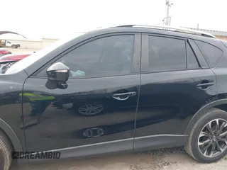 2016 Mazda CX-5 Grand Touring with VIN JM3KE2DY0G0651300, listed as a IAAI auction lot 41678833 with 98,790 mi miles. Bid and sale history available at carsss.com. Image 14.