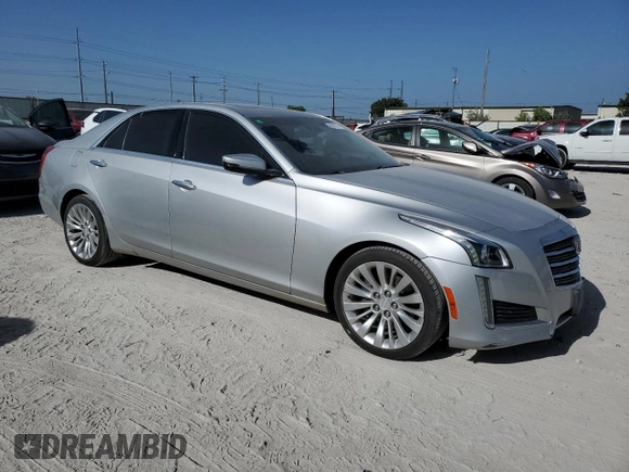 2016 Cadillac CTS Luxury Collection AWD with VIN 1G6AX5SX7G0103193, listed as a Copart auction lot 61808174 with 104,129 mi miles and Clean Title. Bid and sale history available at DreamBid. Image 4.