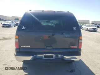 2004 GMC Yukon SLE z VIN 1GKEC13V94R131511, wystawiony jako Copart lot #53184435 z przebiegiem 163 917 mil mil oraz Tytuł czysty. Historia ofert i sprzedaży dostępna na DreamBid. Obrazek 6.