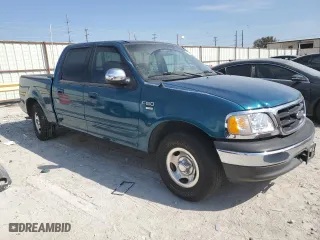 2001 Ford F-150 SuperCrew XLT with VIN 1FTRW07W61KF51152, listed as a Copart auction lot 76799164 with 154,718 mi miles and Salvage Title. Bid and sale history available at carsss.com. Image 4.