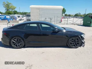 2021 Tesla Model S Plaid with VIN 5YJSA1E66MF452258, listed as a IAAI auction lot 41832000 with 42,845 mi miles and . Bid and sale history available at DreamBid. Image 14.