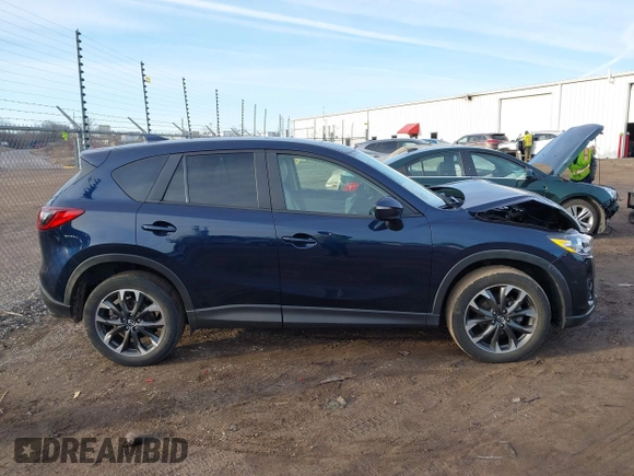 2016 Mazda CX-5 Grand Touring with VIN JM3KE4DY1G0823989, listed as a IAAI auction lot 41770149 with 40,677 mi miles. Bid and sale history available at carsss.com. Image 13.