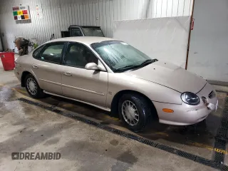 1999 Ford Taurus SE with VIN 1FAFP53S6XA242981, listed as a Copart auction lot 43211425 with 111,966 mi miles and Salvage title. Bid and sale history available at DreamBid. Image 4.