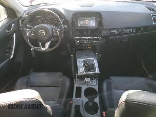 2016 Mazda CX-5 Grand Touring z VIN JM3KE4DY9G0753691, wystawiony jako Copart lot #57361645 z przebiegiem 90 733 mil mil oraz Szkoda całkowita • Salvage title. Historia ofert i sprzedaży dostępna na DreamBid. Obrazek 8.