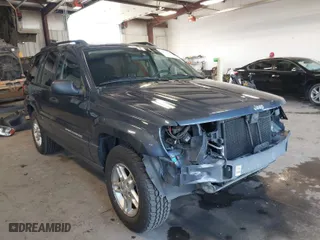 2003 Jeep Grand Cherokee Laredo with VIN 1J4GW48S33C539977, listed as a IAAI auction lot 42027703 with 100,534 mi miles. Bid and sale history available at carsss.com. Image 1.