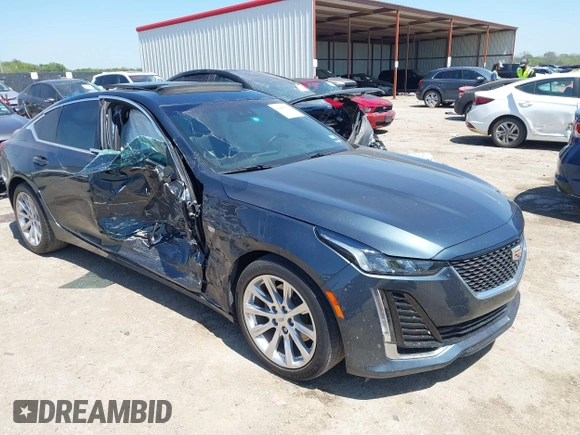 2021 Cadillac CT5 Luxury z VIN 1G6DW5RKXM0144424, wystawiony jako IAAI lot #41985803 z przebiegiem 65 555 mil mil oraz . Historia ofert i sprzedaży dostępna na DreamBid. Obrazek 1.