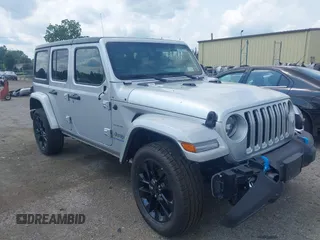 2023 Jeep Wrangler Sahara with VIN 1C4JJXP69PW695915, listed as a IAAI auction lot 42662028 with 36,957 mi miles and . Bid and sale history available at DreamBid. Image 1.