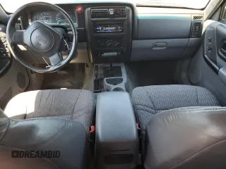 1998 Jeep Cherokee Sport with VIN 1J4FJ68S5WL108020, listed as a Copart auction lot 60150655 with 290,595 mi miles and Salvage title. Bid and sale history available at DreamBid. Image 8.