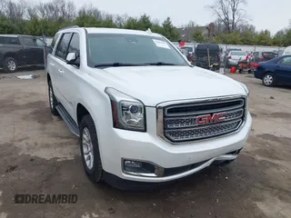 2016 GMC Yukon SLT with VIN 1GKS2BKC5GR374815, listed as a IAAI auction lot 41889495 with 163,464 mi miles. Bid and sale history available at carsss.com. Image 1.