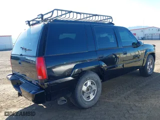 1999 GMC Denali with VIN 1GKEK13R4XR904086, listed as a IAAI auction lot 42034848 with 169,847 mi miles. Bid and sale history available at carsss.com. Image 4.
