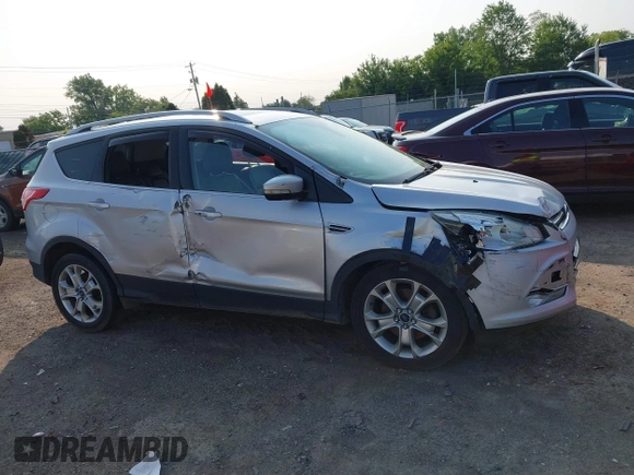 2015 Ford Escape Titanium z VIN 1FMCU0J90FUC02039, wystawiony jako IAAI lot #42369882 z przebiegiem 156 287 mil mil oraz . Historia ofert i sprzedaży dostępna na DreamBid. Obrazek 12.