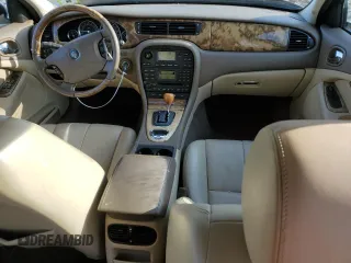 2005 Jaguar S-Type with VIN SAJWA01T55FN14254, listed as a Copart auction lot 86994974 with 126,484 mi miles and Salvage Title. Bid and sale history available at DreamBid. Image 8.