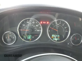 2013 Jeep Wrangler Unlimited Freedom z VIN 1C4BJWDG0DL513902, wystawiony jako Copart lot #52045975 z przebiegiem 166 827 mil mil oraz Szkoda całkowita • Salvage title. Historia ofert i sprzedaży dostępna na DreamBid. Obrazek 9.