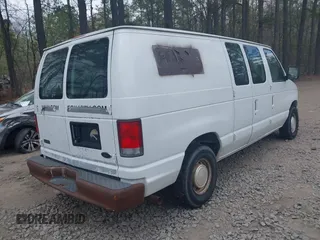 2001 Ford Econoline Cargo with VIN 1FTRE14261HA74696, listed as a IAAI auction lot 41915335 with 124,282 mi miles. Bid and sale history available at carsss.com. Image 4.