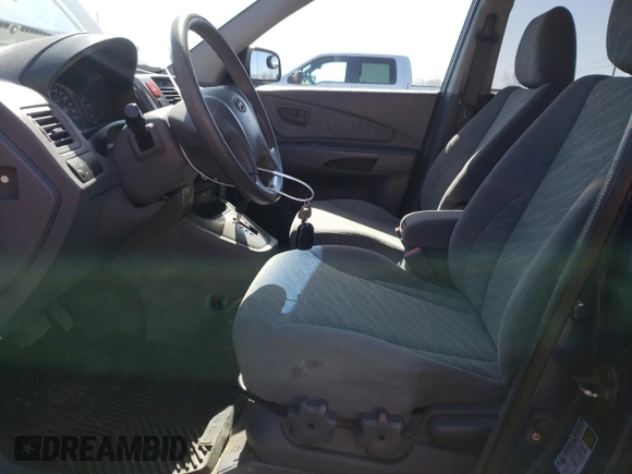 2005 Hyundai Tucson GL with VIN KM8JM72D55U167063, listed as a Copart auction lot 52002865 with 157,945 mi miles and Salvage Title. Bid and sale history available at carsss.com. Image 7.
